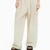 BERSHKA Wide Balloon Fit - Flared Jeans - Beige